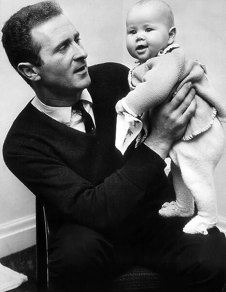 Manchester United goalkeeper Harry Gregg with his four months old daughter Marianne