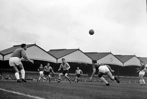 Manchester United goalkeeper Harry Gregg watches closely as th ball comes across his