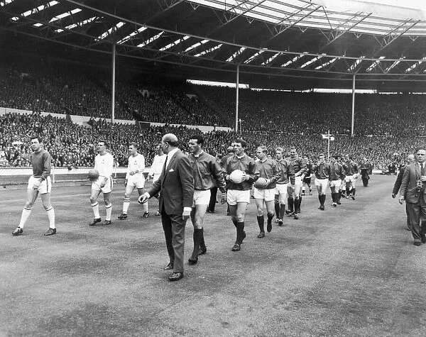 Manchester United and Leicester City walk out on to the pitch at Wembley at the start of