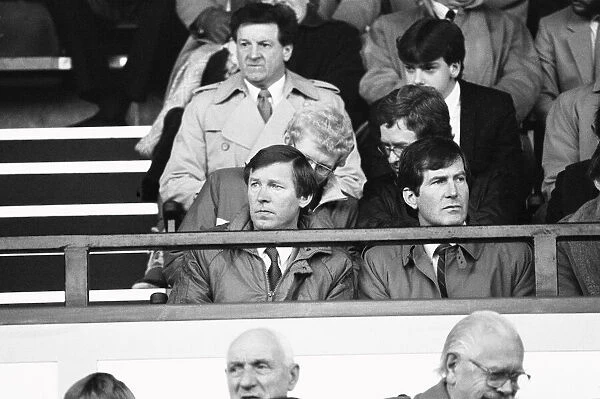 Manchester United manager Alex Ferguson, accompanied by chairman Martin Edwards (right)