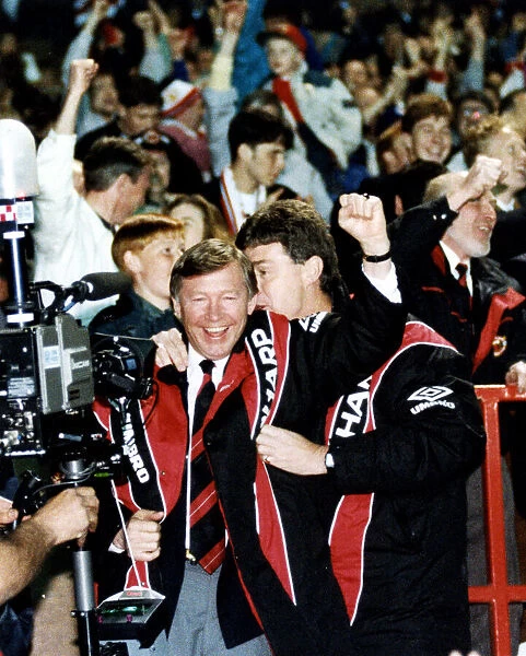 Manchester United manager Alex Ferguson celebrates with assistant Brian Kidd as his team