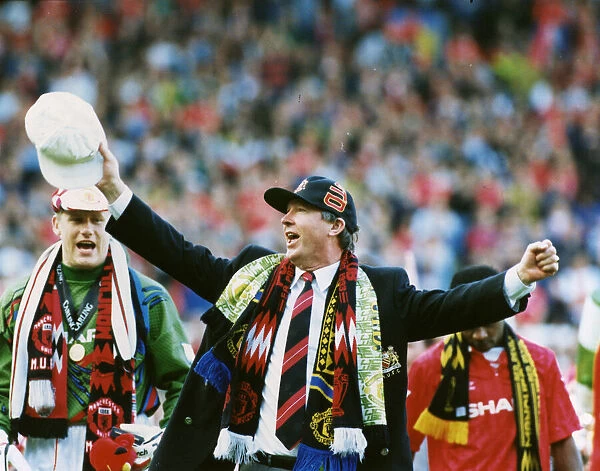Manchester United manager Alex Ferguson celebrates as his team are crowned champions at