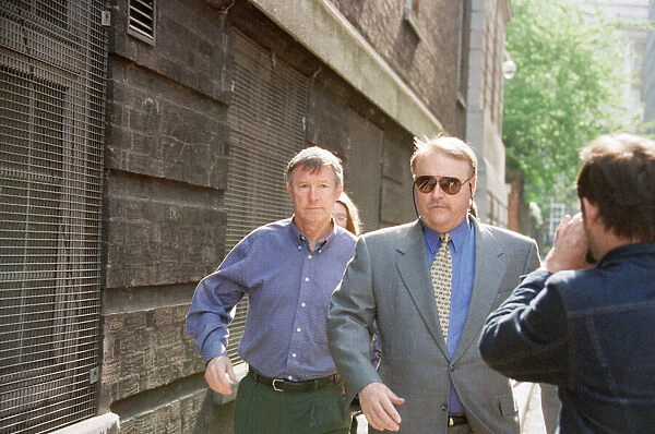 Manchester United manager Alex Ferguson arriving at Bootle Police station where captain