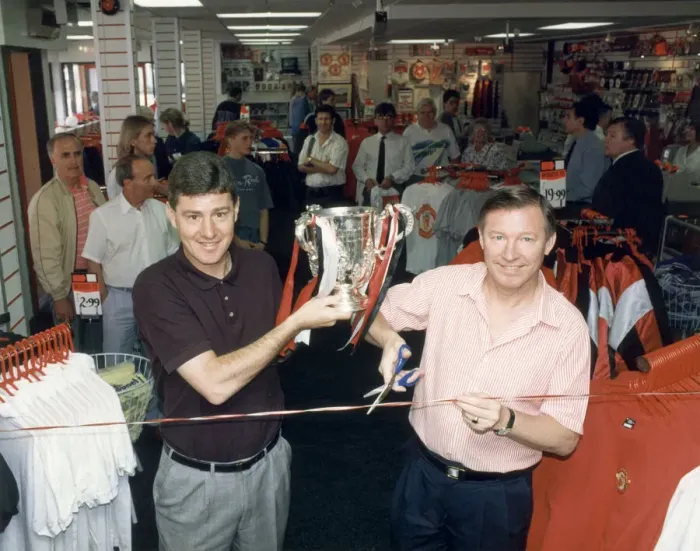 Framed Print : Manchester United manager Alex Ferguson with assistant coach holding the League Cup