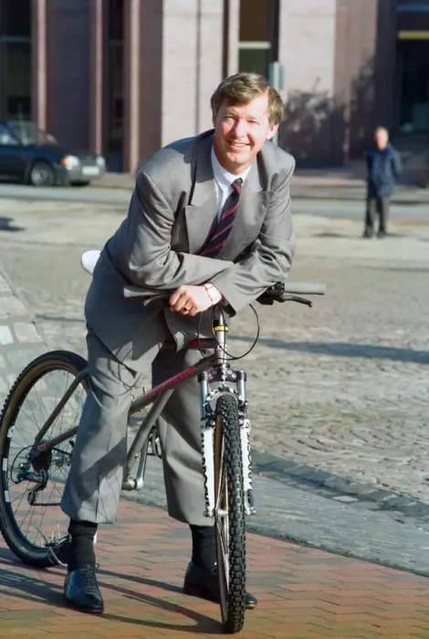Framed Print : Manchester United manager Alex Ferguson pictured on a mountain bike after opening the new