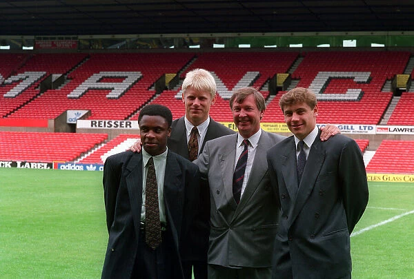 Manchester United manager Alex Ferguson poses with new signings left to right