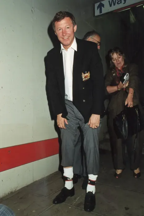 Framed Print : Manchester United manager Alex Ferguson shows off his lucky socks after his teams victory Framed Print : Manchester United manager Alex Ferguson shows off his lucky socks after his teams victory