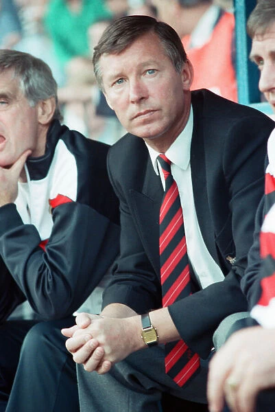 Manchester United manager Alex Ferguson watches his team in action during the League
