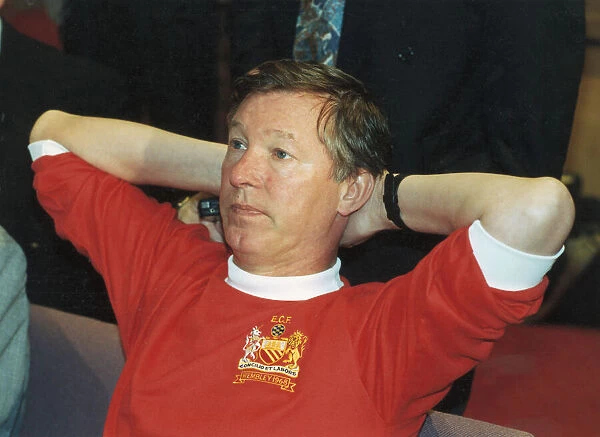 Manchester United manager Alex Ferguson wearing a 1968 European Cup Final shirt for a