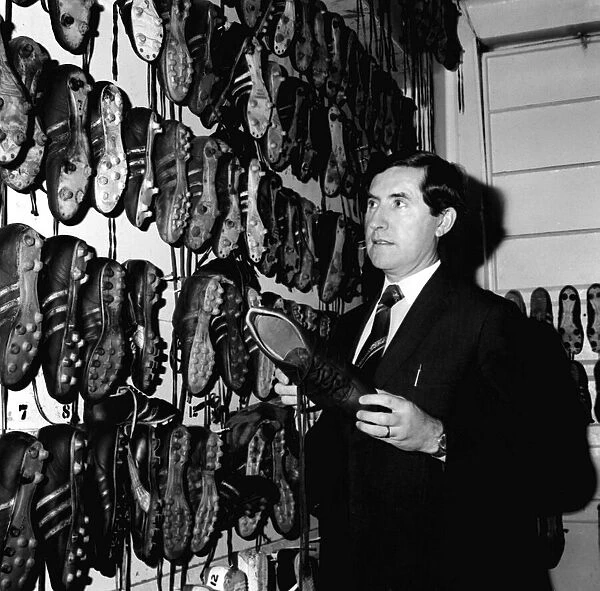 Manchester United manager Frank O Farrell inspects the teams boots in the boot room
