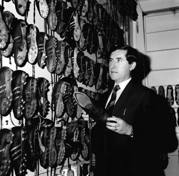 Framed Print : Manchester United manager Frank O Farrell inspects the teams boots in the boot room