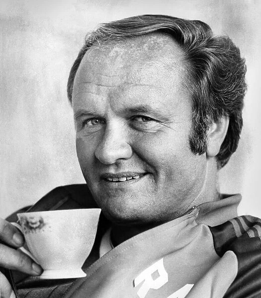 Manchester United manager Ron Atkinson relaxing in his office at the United training
