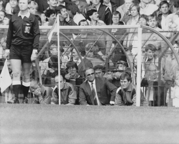 Framed Print : Manchester United manager Ron Atkinson watches from the dug-out Framed Print : Manchester United manager Ron Atkinson watches from the dug-out