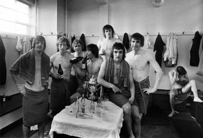Framed Print : Manchester United players celebrate in the changing rooms after being promoted back into Framed Print : Manchester United players celebrate in the changing rooms after being promoted back into