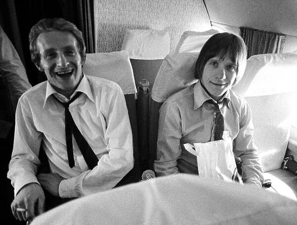 Manchester United players Denis Law and John Fitzpatrick on the plane returning