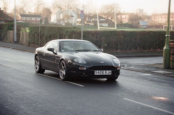 One of the Manchester United players driving their Aston Martin. 1st January 1999