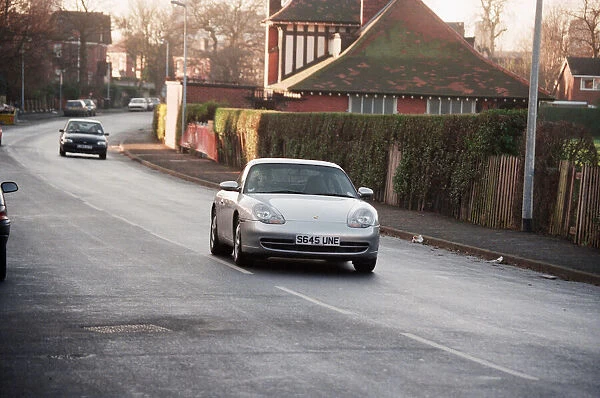 One of the Manchester United players driving their Porsche. 1st January 1999