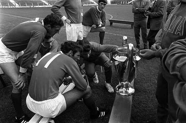 Manchester United players look at the European cup 1968 during photcall after beating