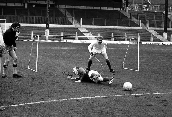 Manchester United players Nobby Stiles and Denis Law playing against each other during a