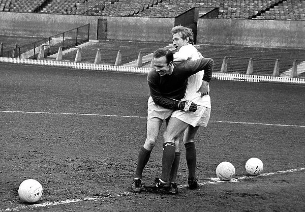 Manchester United players Nobby Stiles and Denis Law training April 1967