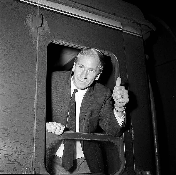Manchester United star Bobby Charlton takes the train to meet up with the England team