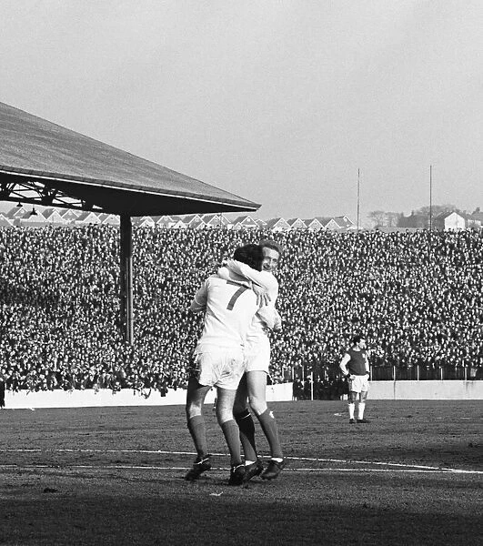Manchester United star George Best is celebrates with team mate Denis Law after scoring