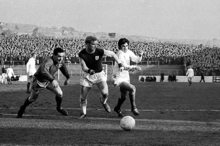 Framed Print : Manchester United star George Best dashes for the ball with Burnley goalkeeper Thomson Framed Print : Manchester United star George Best dashes for the ball with Burnley goalkeeper Thomson