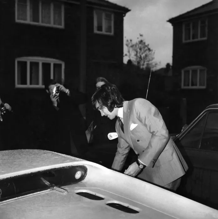 Framed Print : Manchester United star George Best leaving the house to go to the match against