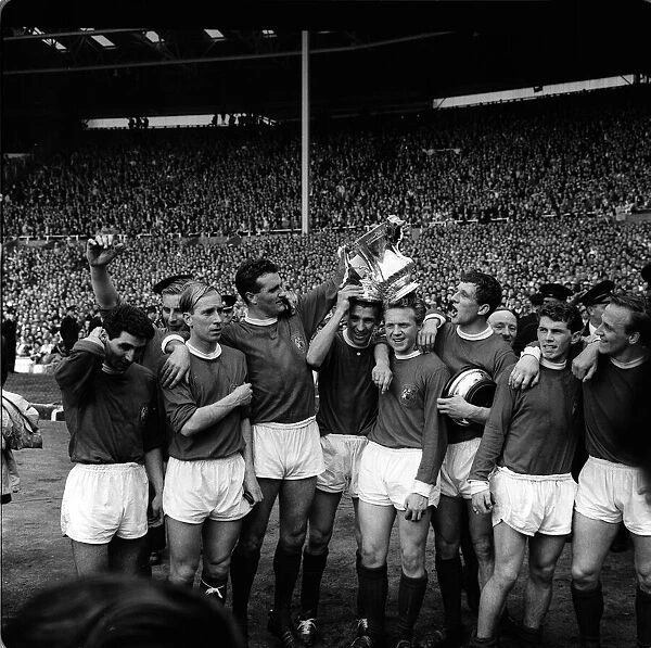 Manchester United team celebrate FA cup final win 1963 over Leicester City