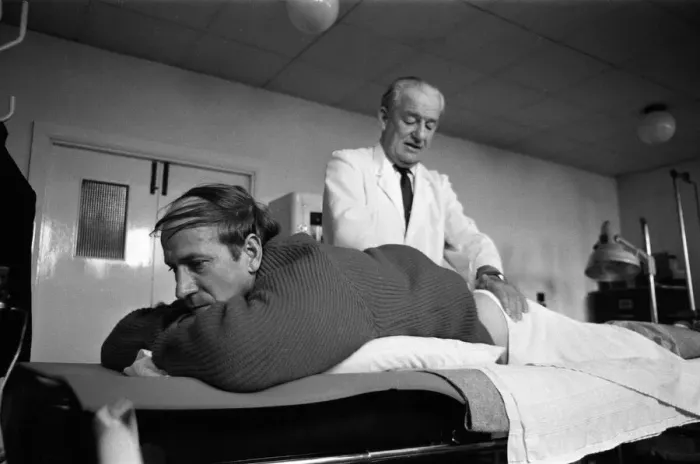 Framed Print : Manchester United training at Old Trafford. Bobby Charlton has treatment