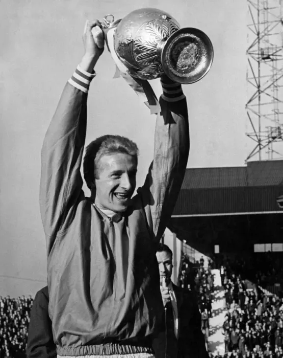 Framed Print : Manchester United v Strasbourg. Bottoms up as skipper Denis Law holds aloft the League Framed Print : Manchester United v Strasbourg. Bottoms up as skipper Denis Law holds aloft the League