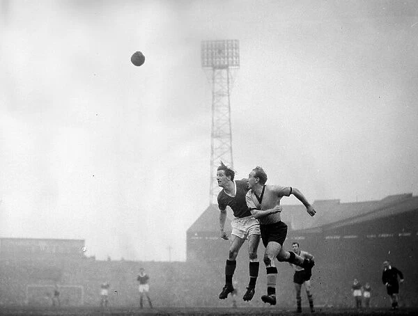 Manchester United v Wolverhampton Wanderers Billy Wright beats Denis Viollet in
