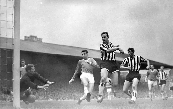 Framed Print : Manchester United versus Newcastle-Harry Greg dives at the ball as United are lucky not