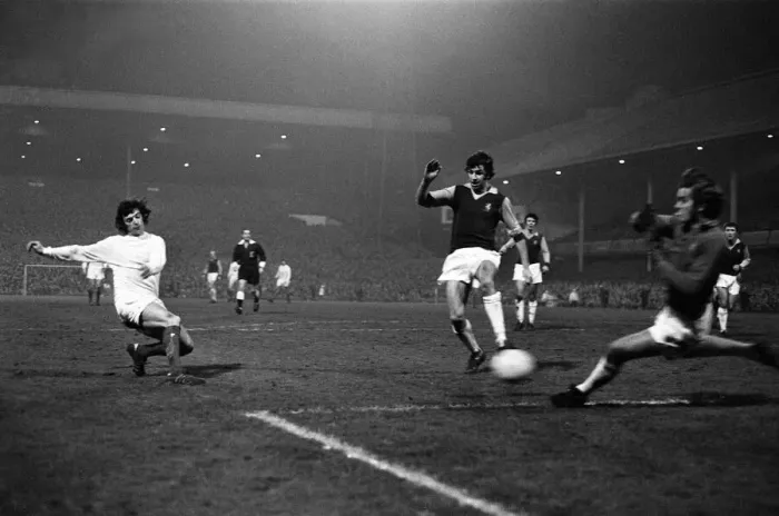 Framed Print : Manchester United winger Willie Morgan attempts a shot on goal at Villa Park during their