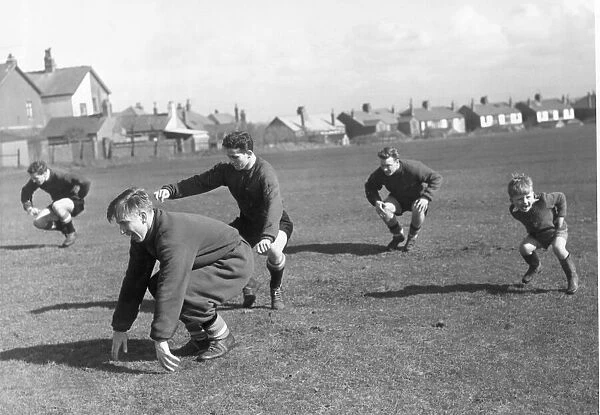 Manchester United. Four year old Charlie Woolett joining in the training session in