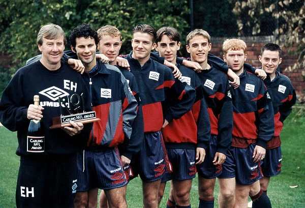 Manchester United youth team coach Eric Harrison is awarded a bottle of champagne