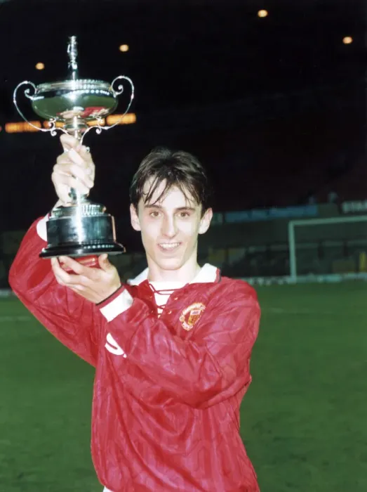 Framed Print : Manchester United youth team player Gary Neville holds up the FA Lancashire Youth Cup