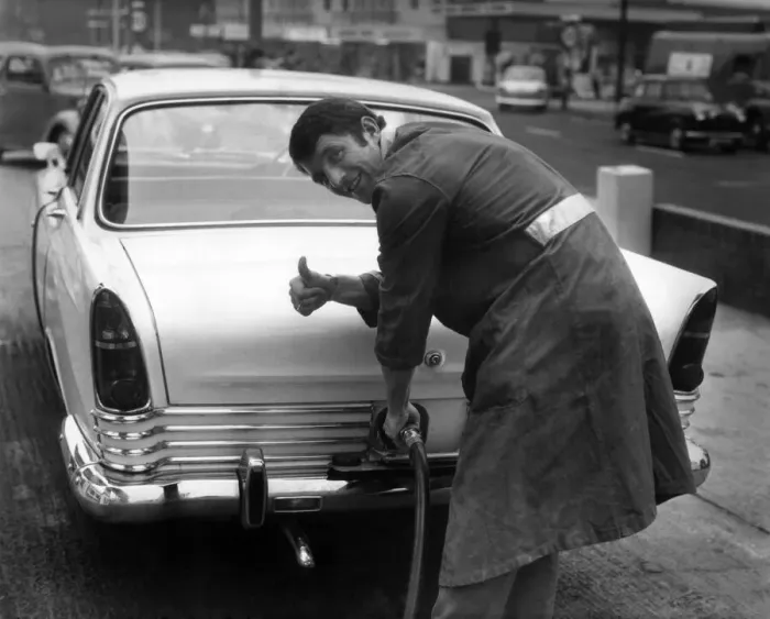 Framed Print : Manchester Uniteds David Herd, pictured filling up a car at his garage in Urmston