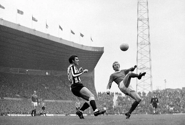 Manchester Uniteds Denis Law controls a high ball watched by Newcastle United