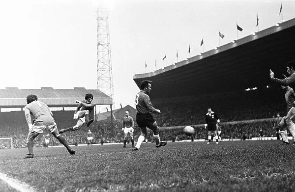 Manchester Uniteds George Best jumps up in the air to hit a low cross on the volley