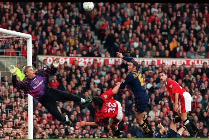 Framed Print : Manchester Uniteds goalkeeper Peter Schmeichel dives to save Wimbledons Dean Blackwell Framed Print : Manchester Uniteds goalkeeper Peter Schmeichel dives to save Wimbledons Dean Blackwell