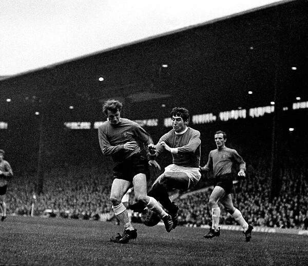 Manchester Uniteds left back Tony Dunne comes flying in to halt an Ipswich player