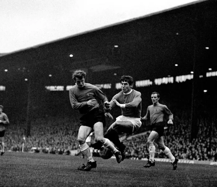 Framed Print : Manchester Uniteds left back Tony Dunne comes flying in to halt an Ipswich player