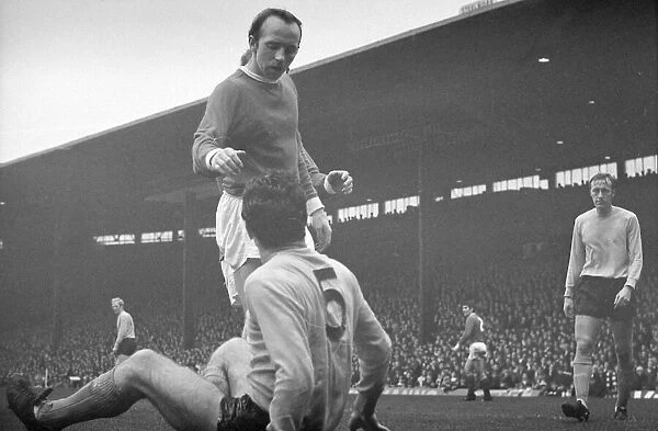 Manchester Uniteds Nobby Stiles helps up an opponent during the league match against