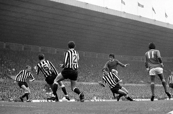 Manchester Uniteds Willie Morgan takes on four Newcastle united defenders in a goal