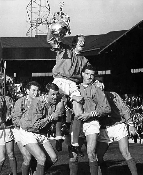 Manchester Utd v Strasbourg. Herd and Foulkes hoist skipper Denis Law shoulder high as he