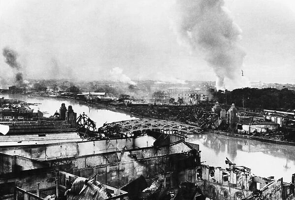 Manila on fire as US forces liberate the Philippine capital. 18th March 1945