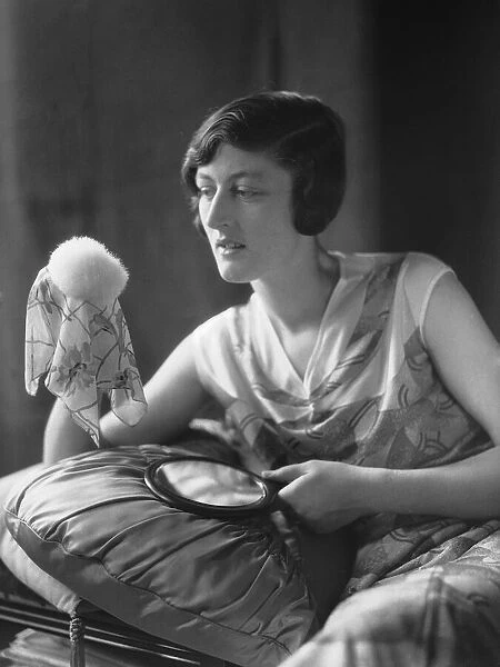 Mannequin seen here applying powder before a fashion shoot for the latest 1932 fashions