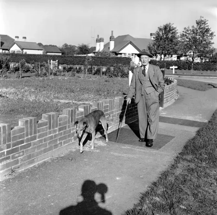 Framed Print : Mans best friend: Man walking a dog. Circa 1954 Framed Print : Mans best friend: Man walking a dog. Circa 1954