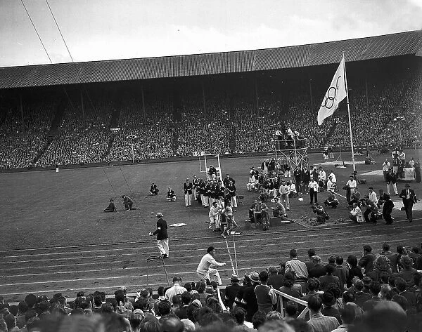 Marathon race runner crosses the finish line August 1948 at Wembley during